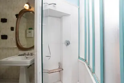 a bathroom with a sink and a mirror at Cozy Gambero Apartments in Rome