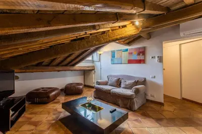 a living room with a couch and a table at Cozy Gambero Apartments in Rome