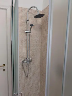 a shower with a shower head in a bathroom at Da Tony vicino San Pietro in Rome