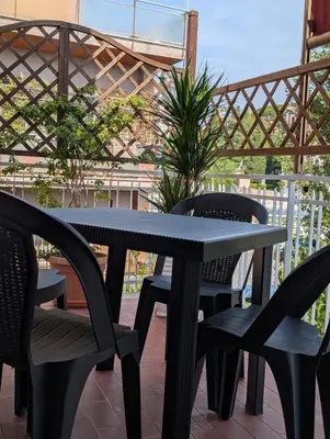 a black table and chairs on a patio at Da Tony vicino San Pietro in Rome