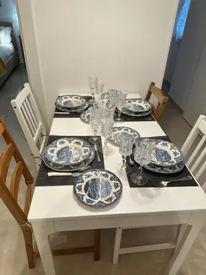 a white table with blue and white plates on it at Welcome to Campo De' Fiori in Rome