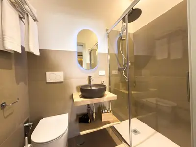 a bathroom with a sink and a shower at Vatican Domus Stefania Guest House in Rome