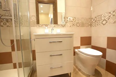 a bathroom with a toilet and a sink and a shower at Chez Noel in Rome