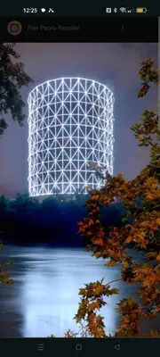 a large white object is lit up over a lake at Chez Noel in Rome