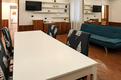 a living room with a white table and chairs at Restart Accommodations Pantheon in Rome