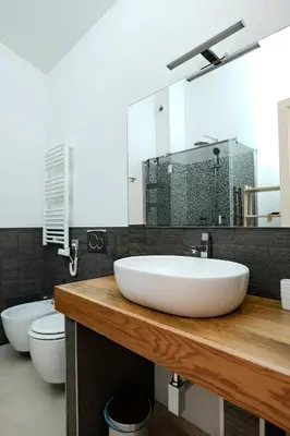 a bathroom with a white sink and a toilet at Restart Accommodations Dea Roma in Rome