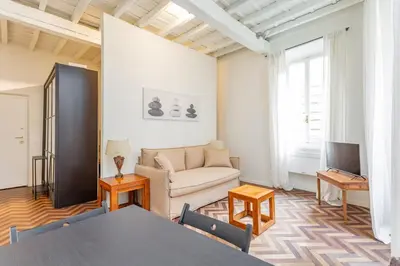 a living room with a couch and a table at Navona Urban Sanctuary in Rome