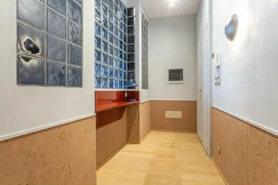 a hallway with a wall of glass bottles at Spanish Steps Exclusive 3BDR in Rome