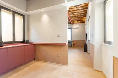 an office space with a long hallway with windows at Spanish Steps Exclusive 3BDR in Rome