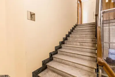 a set of stairs in a building with a window at CdR 190 - Vaticano in Rome