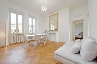 a living room with a white couch and a table at Vatican Basilica Apartment in Rome