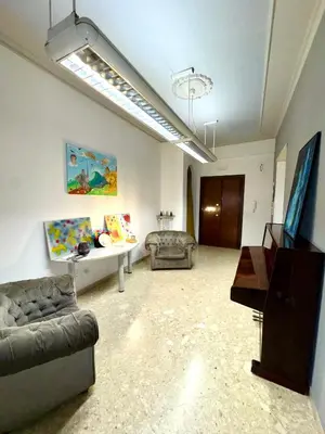 a living room with a couch and a table at La casa di Ezechiele in Rome
