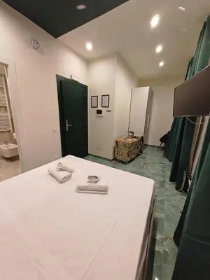 a room with a bed with two towels on it at Cozy Luxury room San Pietro in Rome