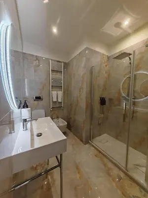 a bathroom with a sink and a shower at Cozy Luxury room San Pietro in Rome