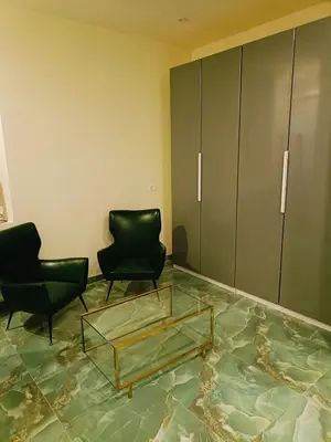 a living room with two chairs and a glass table at Cozy Luxury room San Pietro in Rome