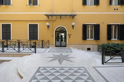 a building with a star on the courtyard at La Tua Casa al Colosseo in Rome