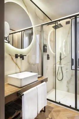 a bathroom with a sink and a shower at Oriana Homèl Roma in Rome