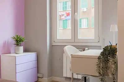 a room with a white desk and a window at cosy apt close to metro San Paolo in Rome