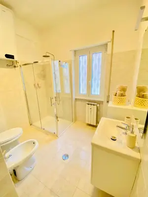 a bathroom with a toilet and a shower and a sink at La Casa di Giada in Rome