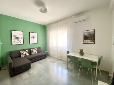 a living room with a couch and a table at La Casa di Giada in Rome