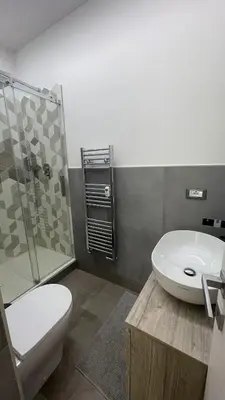 a bathroom with a toilet and a sink and a shower at Apartment in the heart of Rome in Rome