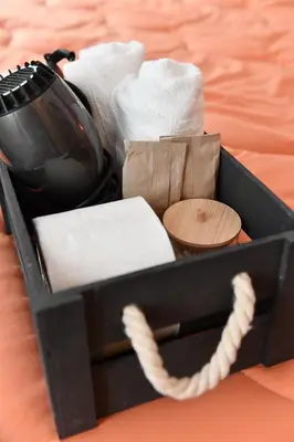 a black box filled with towels and towels at Nest house in Rome