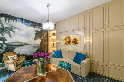 a living room with a couch and a table at Tu chiamale emozioni intero appartamento in Rome