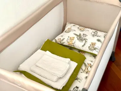 a drawer with two sheets and towels in it at La Casa Blu in Rome