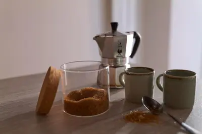 a table with two cups of coffee and a blender at Piazza Cancelleria in Rome