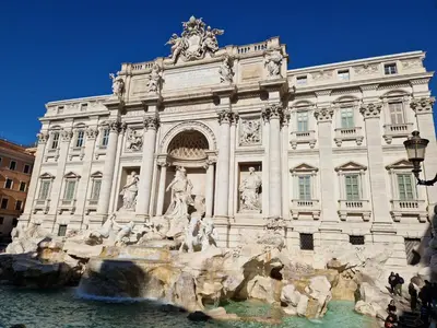 a building with a fountain in front of it at Piazza Cancelleria in Rome