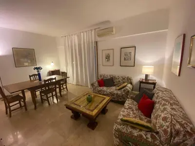 a living room with a couch and a table at Desy Vatican House in Rome