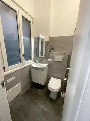 a bathroom with a shower and a toilet and a sink at Desy Vatican House in Rome