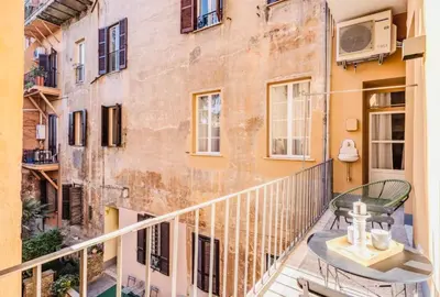 a balcony with a table and a building at Rome at Home in Rome