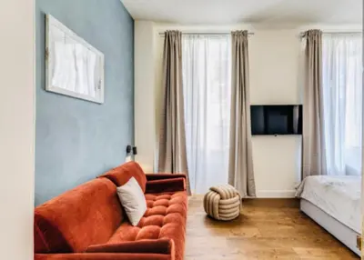 a living room with a couch and a bed at Rome at Home in Rome