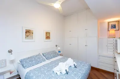 a bedroom with a bed with a dog statue on it at Trastevere Relax by Rental in Rome in Rome