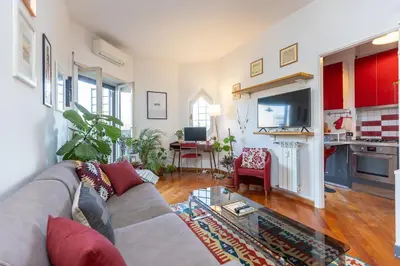 a living room with a couch and a table at Trastevere Relax by Rental in Rome in Rome