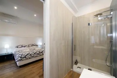 a bathroom with a sink and a mirror at Domus Pio VIII in Rome