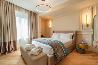 a bedroom with a large bed with towels on it at Trevi Imperial Suite 2 in Rome