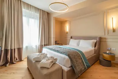 a bedroom with a large bed with towels on it at Trevi Imperial Suite 1 in Rome