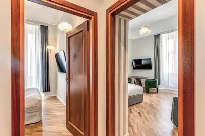 a room with a door leading to a bedroom at DOWNTOWN SRL - The Great Court and The Great Chill in Rome