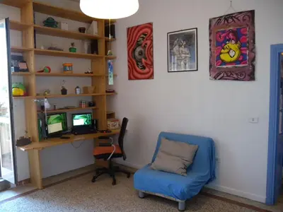 a room with a desk and a chair and a computer at Esquilino Piano Alto in Rome