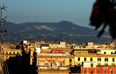 a view of a city with a mountain in the background at Esquilino Piano Alto in Rome