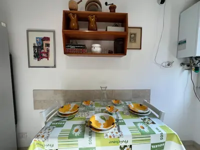 a dining room table with plates of food on it at Feel at home in Rome