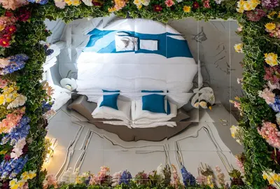 a display of flowers in a room with a bed at Flowers' Circle of piazza di Spagna in Rome