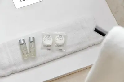 a set of three products sitting on top of a counter at Modern flat in Termini Station in Rome