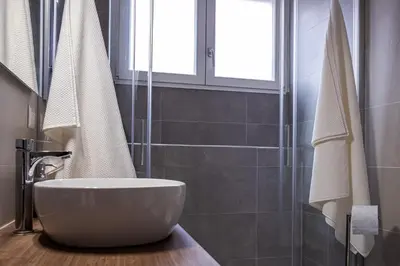 a bathroom with a bowl sink and a shower at A un passo da San Pietro in Rome
