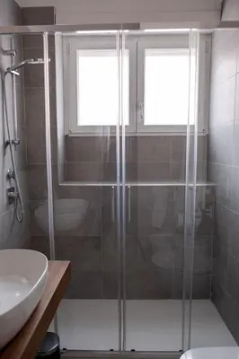 a bathroom with a shower and a toilet and a sink at A un passo da San Pietro in Rome
