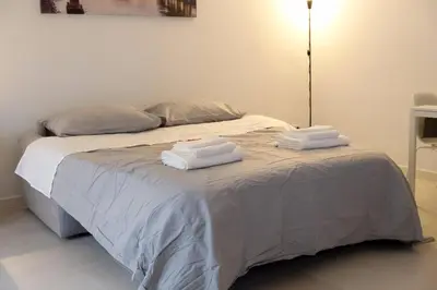 a bed with two towels on top of it at A un passo da San Pietro in Rome