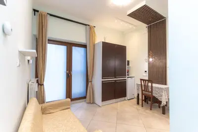 a living room with a couch and a table at Casa Arco Roma in Rome