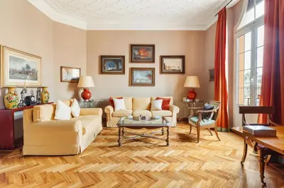 a living room with a couch and a table at Casa Augusta, a Burghesius home in Rome